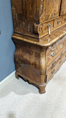 Lot 959 - A Dutch burr walnut bombe cabinet on chest, late 18th/early 19th Century