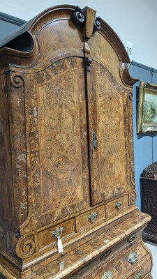 Lot 959 - A Dutch burr walnut bombe cabinet on chest, late 18th/early 19th Century