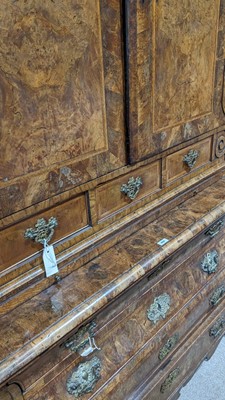 Lot 959 - A Dutch burr walnut bombe cabinet on chest, late 18th/early 19th Century