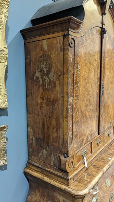 Lot 959 - A Dutch burr walnut bombe cabinet on chest, late 18th/early 19th Century