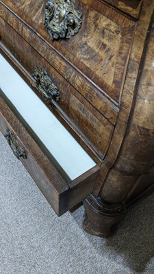 Lot 959 - A Dutch burr walnut bombe cabinet on chest, late 18th/early 19th Century