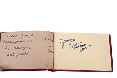 Lot 386 - The Beatles signatures: An autograph book containing the signatures George Harrison and Ringo Star