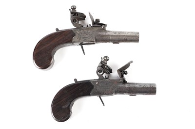 Lot 1036 - A near matching pair of flintlock pocket pistols