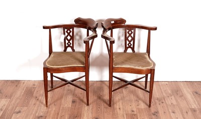 Lot 55 - A pair of Edwardian corner armchairs