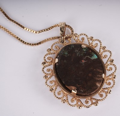 Lot 1090 - A black boulder opal pendant