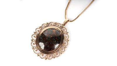 Lot 1090 - A black boulder opal pendant