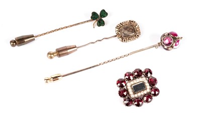 Lot 1095 - A Victorian mourning brooch and three tie pins