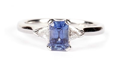 Lot 1306 - A sapphire and diamond three-stone dress ring