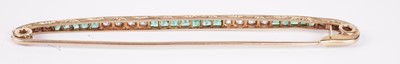 Lot 1125 - A Belle Epoque French emerald and diamond bar brooch