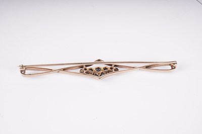 Lot 1130 - A sapphire and diamond openwork bar brooch