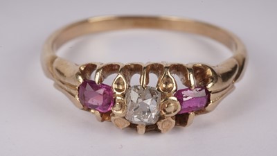 Lot 1137 - A ruby and diamond dress ring