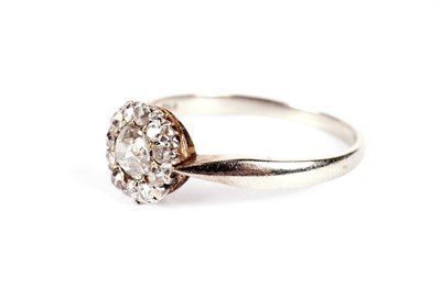 Lot 1140 - A diamond flowerhead cluster dress ring
