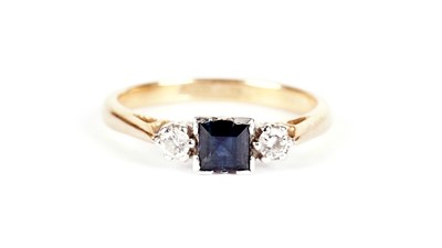 Lot 705 - A three stone sapphire and diamond ring