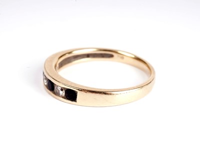 Lot 366 - A sapphire and diamond half-hoop eternity ring