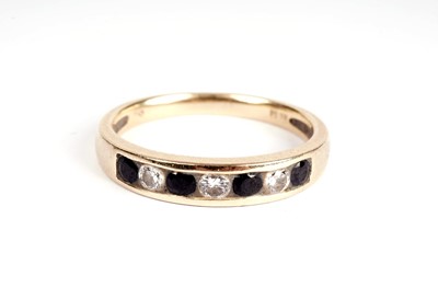 Lot 366 - A sapphire and diamond half-hoop eternity ring