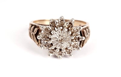 Lot 365 - A diamond cluster dress ring