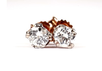 Lot 1107 - A pair of diamond stud earrings