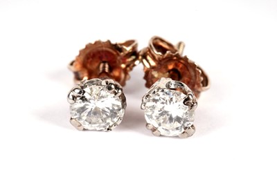 Lot 1107 - A pair of diamond stud earrings