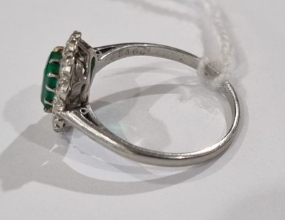 Lot 1314 - An emerald and diamond cluster ring