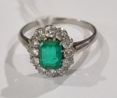 Lot 1314 - An emerald and diamond cluster ring