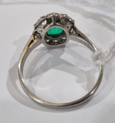 Lot 1314 - An emerald and diamond cluster ring