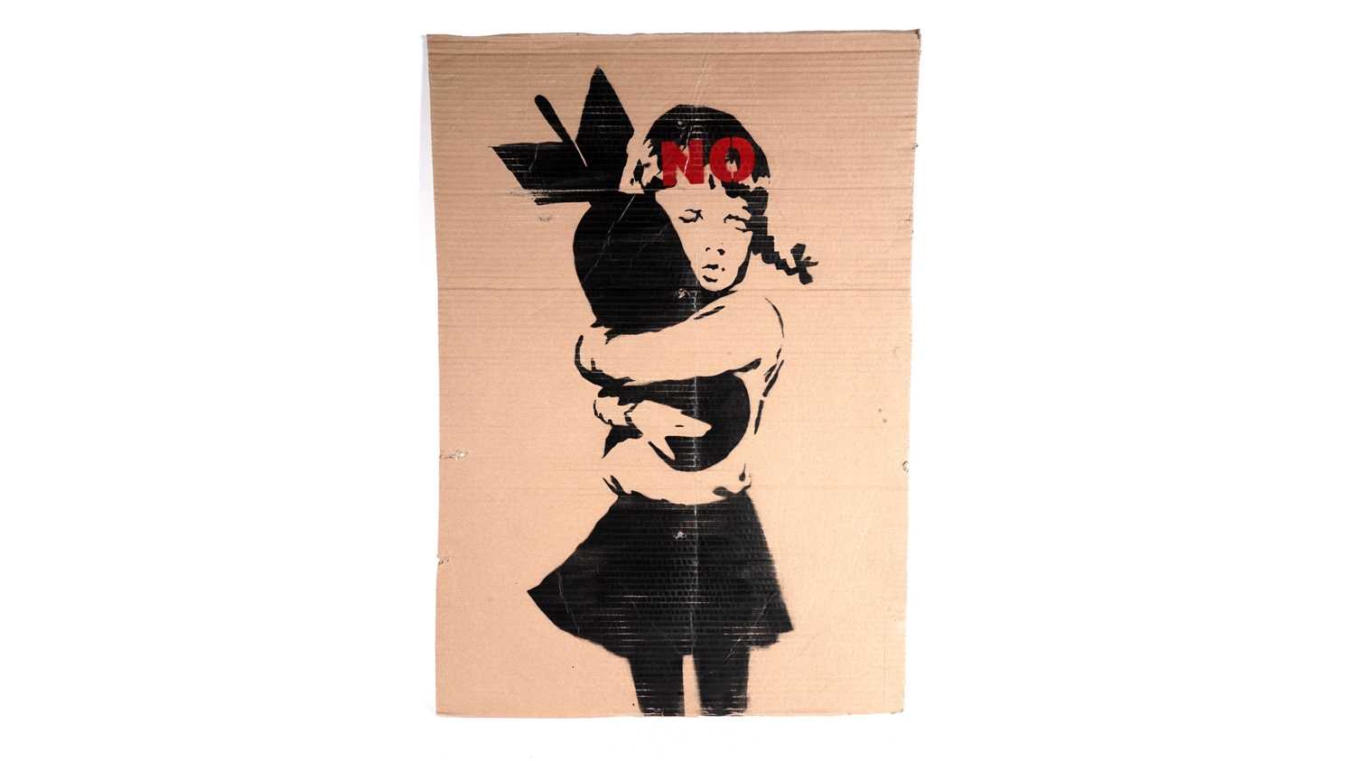 Lot 701 - BANKSY - "Bomb Hugger" / NO Anti-Iraq War Protest March Placard | spray paint on cardboard