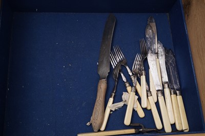 Lot 443 - A canteen of flatware and cutlery in a fitted oak case; with two matching basting spoons