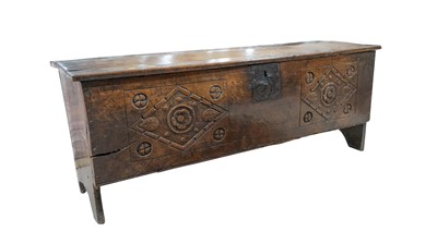 Lot 967 - A carved oak six plank oak coffer, late 17th/early 18th Century