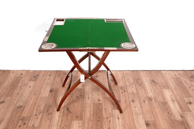 Lot 51 - A mahogany folding campaign games/card table, in the manner of J. C. Vickery (London)
