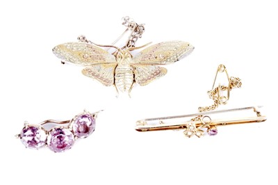 Lot 590 - A yellow gold butterfly brooch; and two others