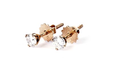 Lot 588 - A pair of diamond stud earrings