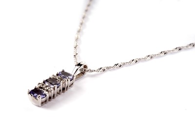 Lot 374 - A tanzanite and diamond pendant on chain