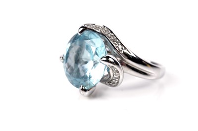 Lot 1138 - A topaz and diamond cocktail ring