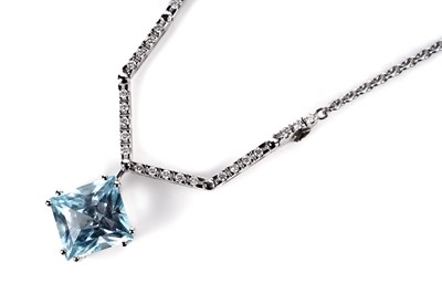 Lot 1139 - A topaz and diamond pendant necklace