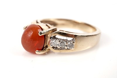 Lot 1140 - A fire opal and diamond ring