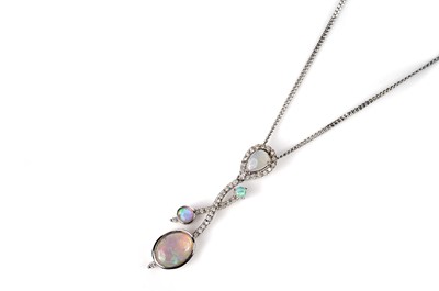 Lot 1141 - An opal and diamond pendant