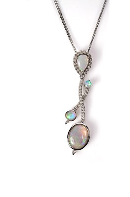 Lot 1141 - An opal and diamond pendant