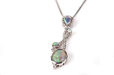 Lot 1141 - An opal and diamond pendant