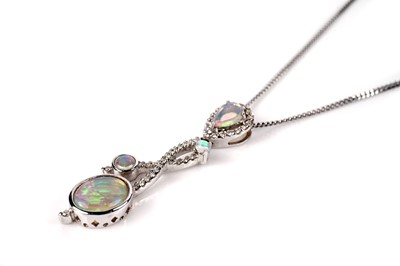 Lot 1141 - An opal and diamond pendant