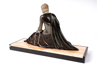 Lot 177 - An Art Deco model of a lady kneeling with a deer