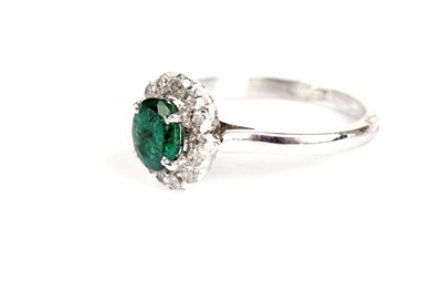 Lot 361 - An emerald and diamond cluster ring