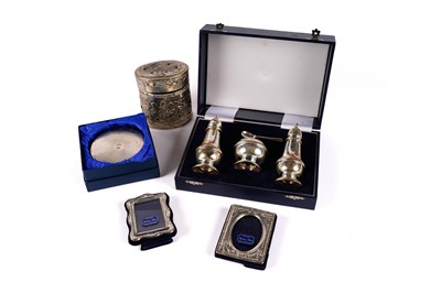 Lot 582 - A silver cruet set, and others