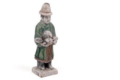 Lot 398 - A Chinese Ming style terra cotta figure