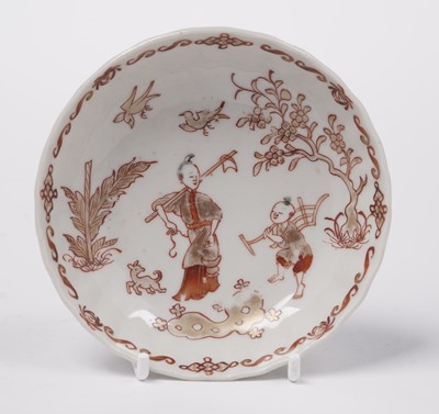 Lot 284 - A Chinese export 'Rouge de Fer' tea bowl and saucer