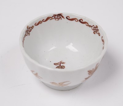 Lot 284 - A Chinese export 'Rouge de Fer' tea bowl and saucer