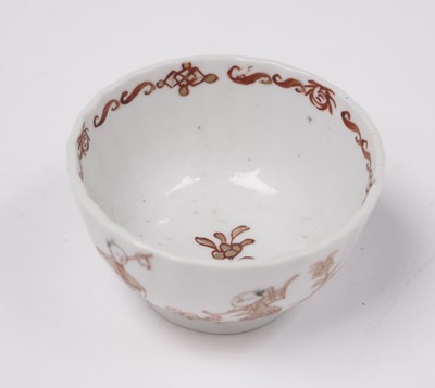 Lot 284 - A Chinese export 'Rouge de Fer' tea bowl and saucer