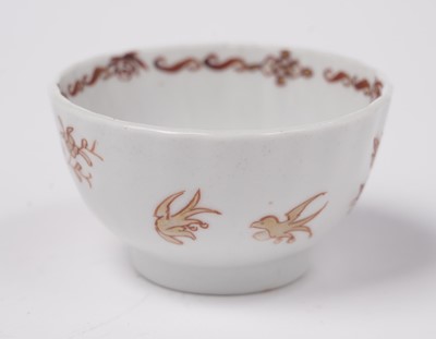 Lot 284 - A Chinese export 'Rouge de Fer' tea bowl and saucer