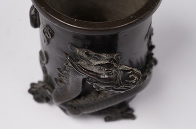 Lot 414 - A Chinese bronze brush pot