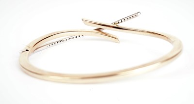 Lot 355 - A white stone and 9ct gold bangle