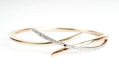 Lot 355 - A white stone and 9ct gold bangle